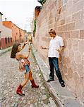 Couple Taking Photo by Wall, Mexico