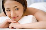 Smiling woman on massage table