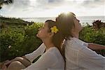 Couple relaxing at sunset