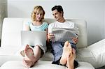 Couple Sitting on Sofa