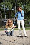 Mother with Daughter in City Playground