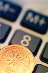 Close-up of Eurocent coin on calculator