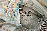 Image of man wearing glasses on bank note, extreme close-up
