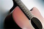 Close-up of electric guitar, its strings and frets