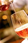 Close-up of wine being poured into a wineglass