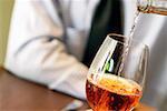 Close-up of wine being poured into a wineglass