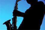 Silhouette of a musician playing the saxophone