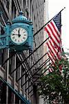 Low angle view of a clock on a building, Marshall Field's Building, Chicago, Illinois, USA