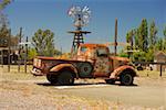 Abandoned pick-up truck parked on a field