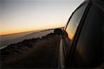 Car parked on a hill at dusk