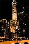 Tower lit up at night, Water Tower Chicago, Illinois, USA