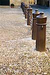 Chain-link fence on a sidewalk, Spain
