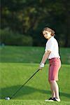 A young woman contemplates before playing a shot