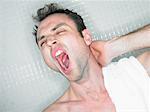 Man Yawning in Shower