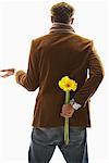 Man Holding Flowers Behind Back
