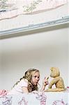 Girl Playing With Teddy Bear