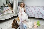 Girl Playing with Toys in Bedroom