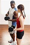 Man and Woman Lifting Weights