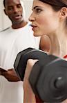 Man and Woman Lifting Weights