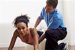 Personal Trainer Helping Woman