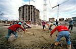 Construction workers pouring cement in new office building in Bethesda, Maryland