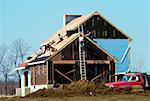 Carpenters putting roof on new home in Maryland