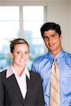 Portrait of a businessman and a businesswoman smiling