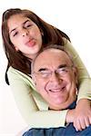 Portrait of a granddaughter sticking out her tongue and hugging her grandfather