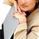 Close-up of a businesswoman leaning on a laptop
