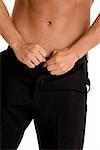 Mid section view of a man buttoning his pants