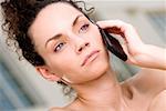 Close-up of a young woman talking on a mobile phone