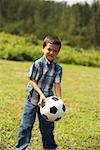 Portrait of a boy holding a soccer ball