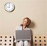 Businesswoman Looking at Clock