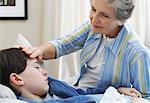 Grandmother Caring for Sick Grandson