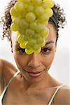 Woman Holding Bunch of Grapes