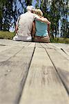 Couple Sitting on Dock