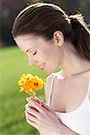 Woman Smelling Wildflower