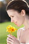 Woman Smelling Wildflower