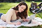 Woman Using Laptop Outdoors