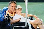 Couple On Golf Cart