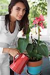 Woman Watering Plant