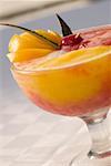 Close-up of orange juice in a stem glass