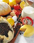 High angle view of an alarm clock with food ingredients