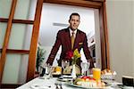 Portrait of a waiter serving food