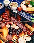 High angle view of assorted meats on a barbecue grill