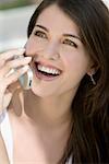 Close-up of a young woman talking on a mobile phone