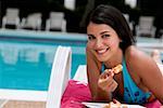 Portrait of a young woman having a meal