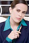 Close-up of a businesswoman holding a pen