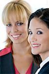 Portrait of two businesswomen smiling