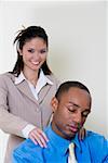 Businessman sleeping with a businesswoman standing behind him